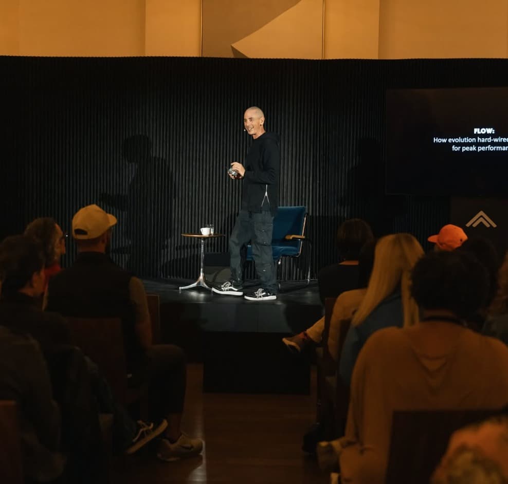 Steven Kotler on stage at a Flow Institute event