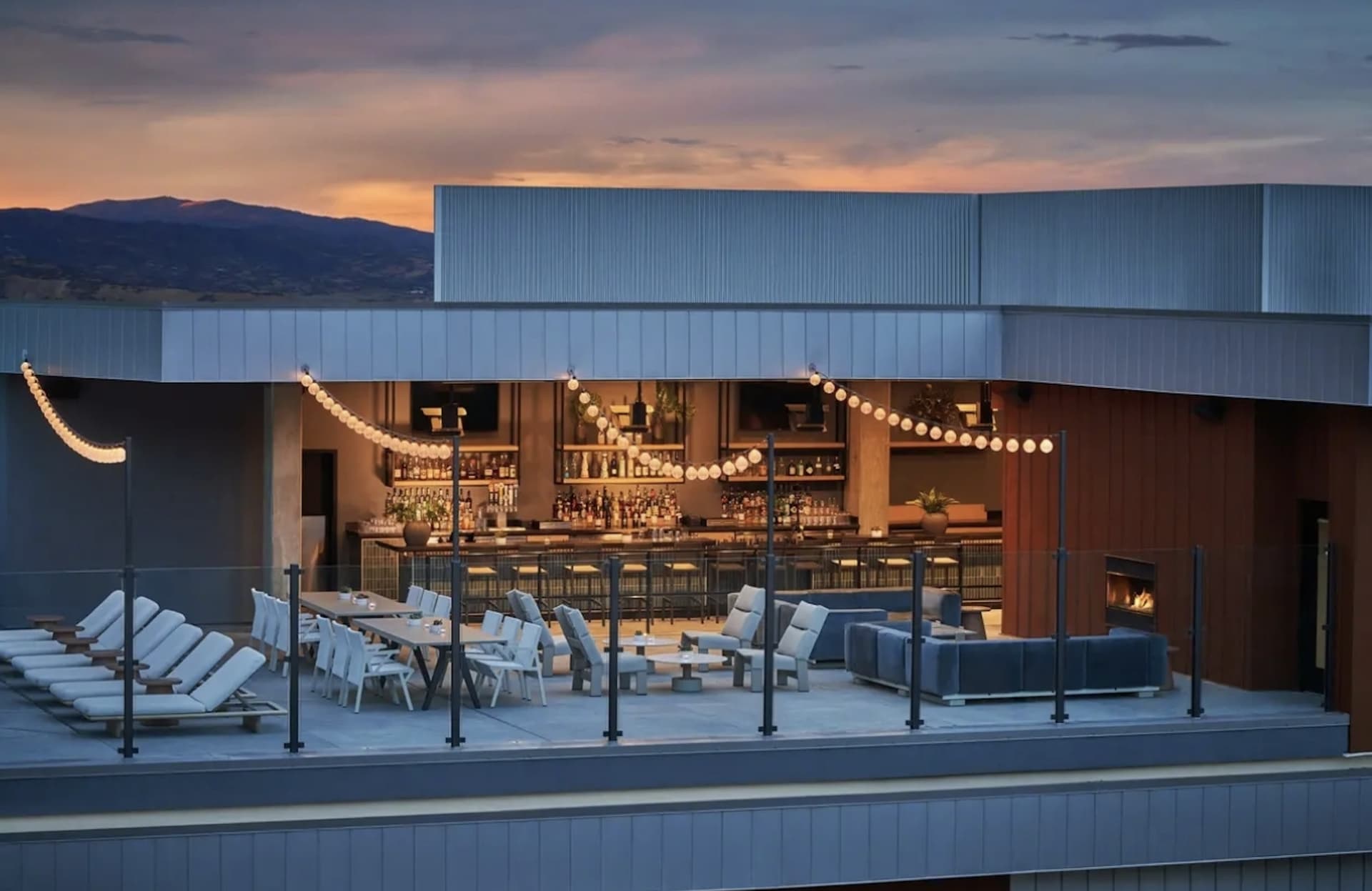 The Pendry rooftop bar at sunset, overlooking the mountains